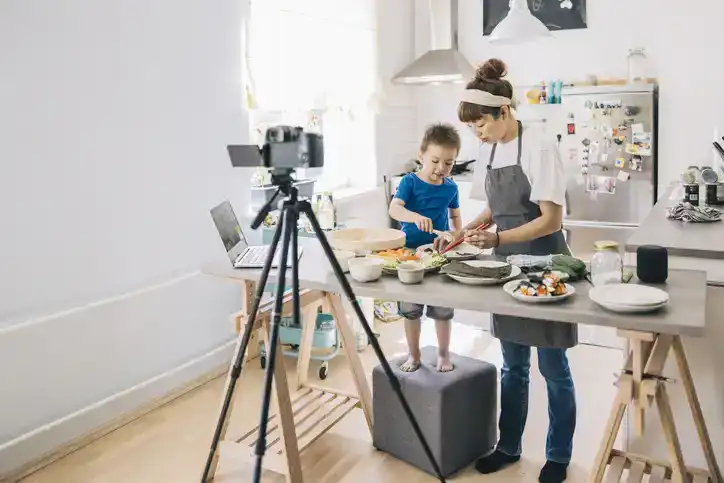 filming cooking tutorial with son