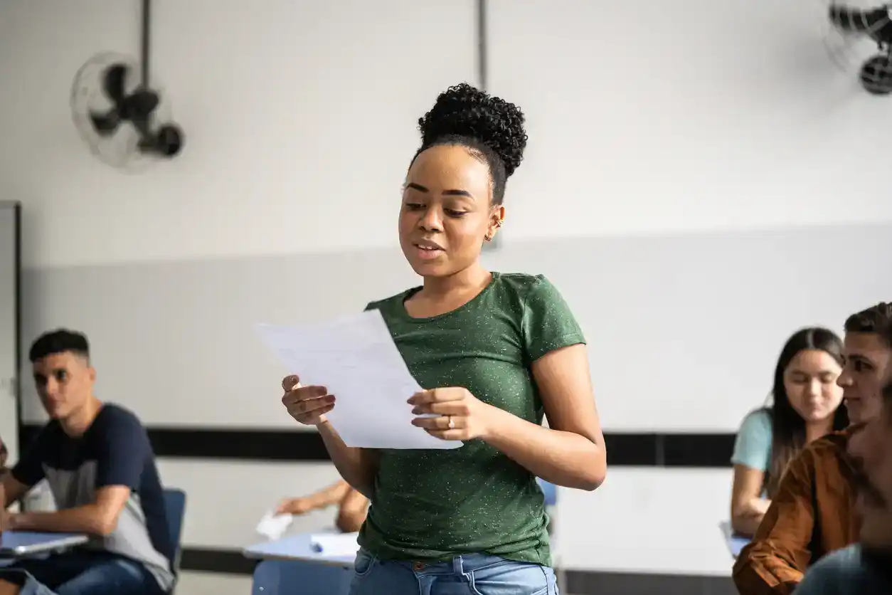 black teen girl reading in class
