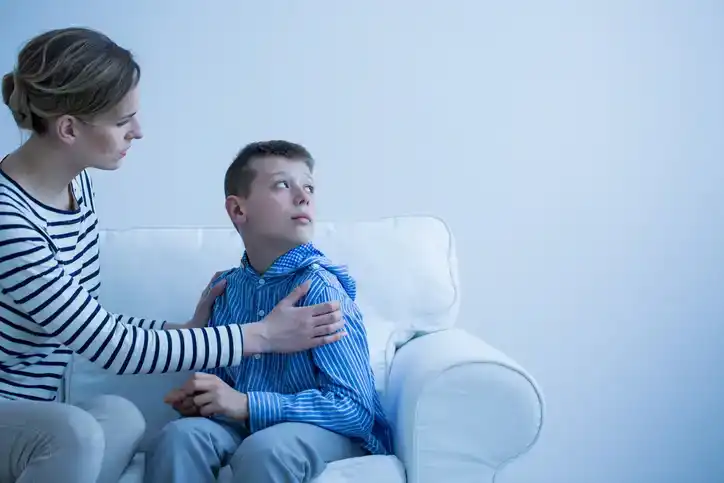 mom comforting worried son