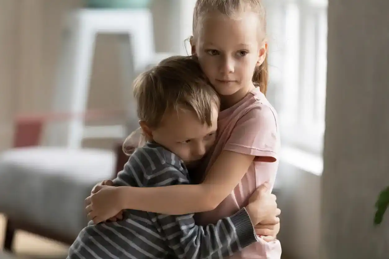Small children brother and sister hug showing love