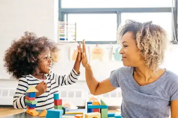 Mom building blocks with her daughter