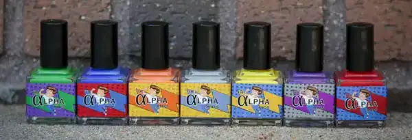 A row of Alpha Kids nail polish bottles