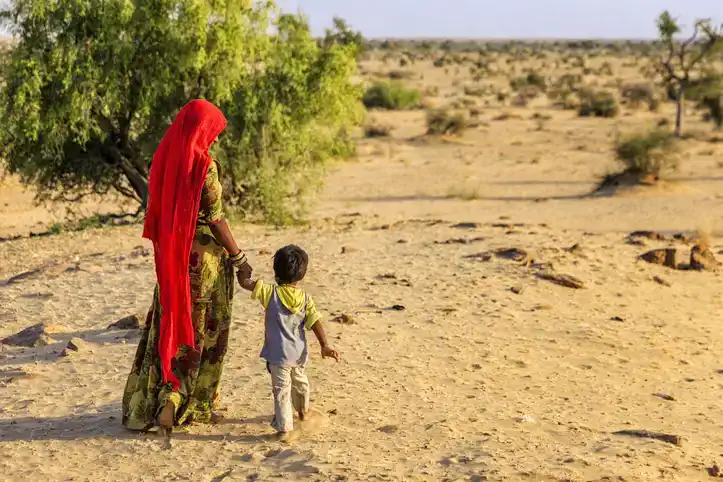 mom and son in African desert