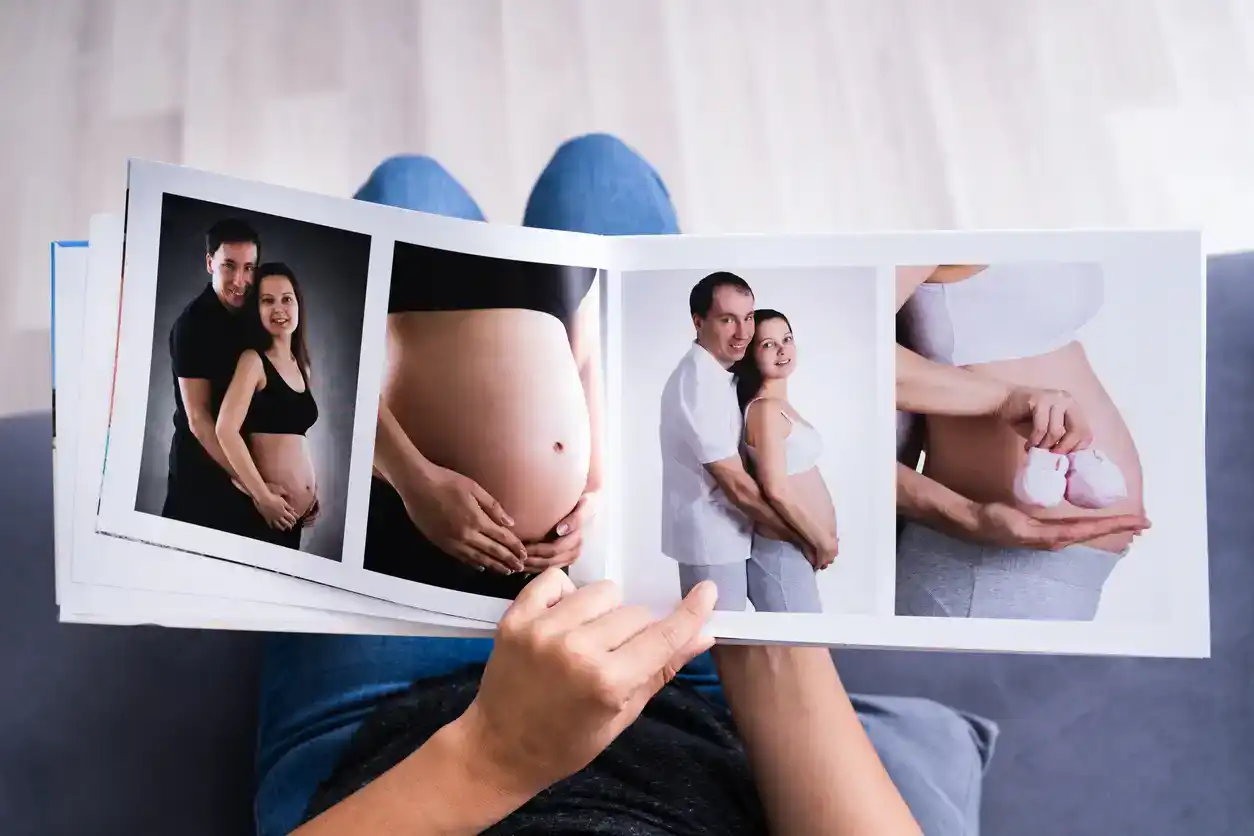 Woman Looking At Photo Album