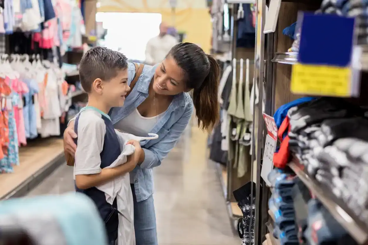 Mother and son back to school shopping for new clothes