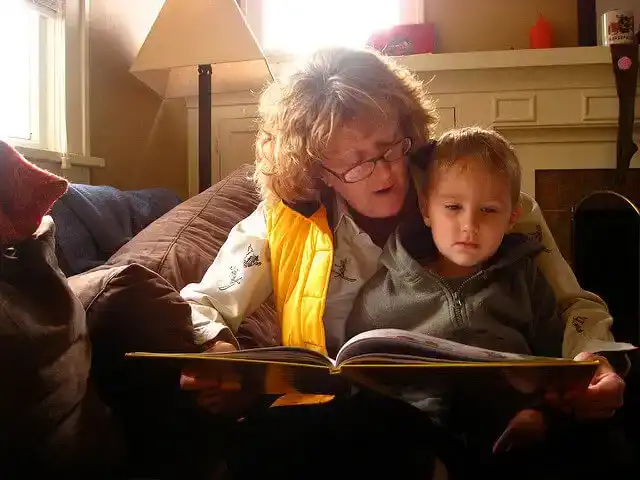 Woman Reading to Young Girl