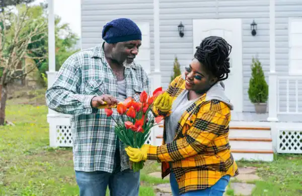 dad giving teen daughter flowers