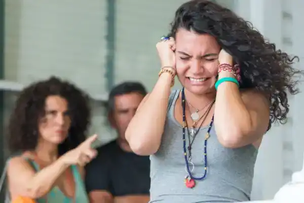 teen daughter crying and arguing with parents
