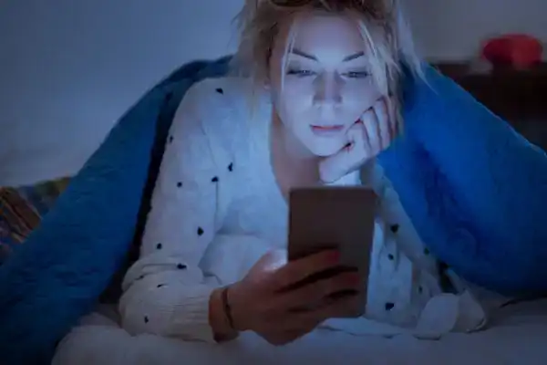 girl with college anxiety up late at night