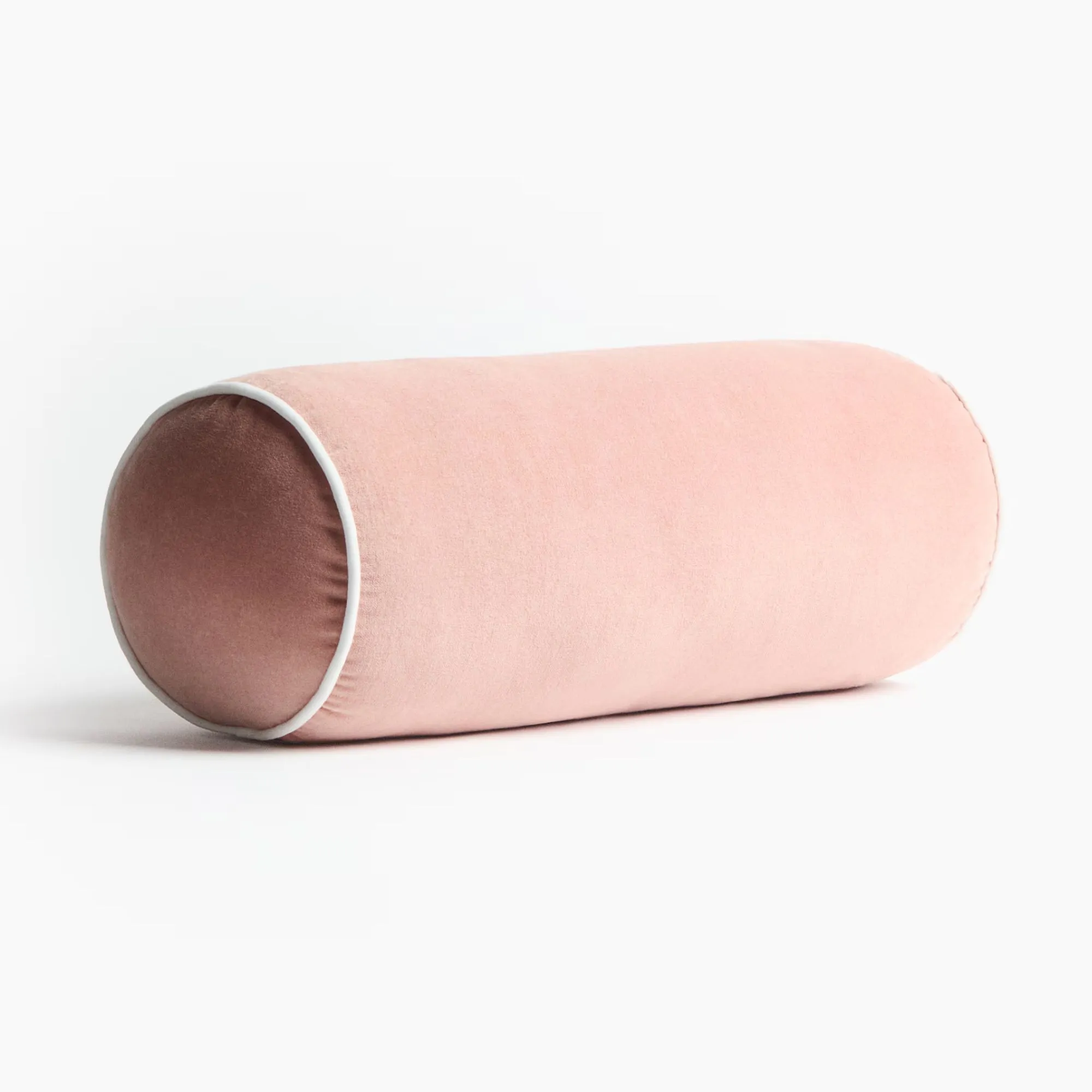 ホワイトのトリムが付いたピンクのボルスタークッション' loading='lazy' title=