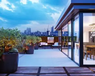 Roof Garden con área deck, iluminación y asientos.