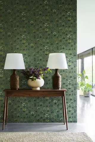 Grønt tapet med små pletter af blomster