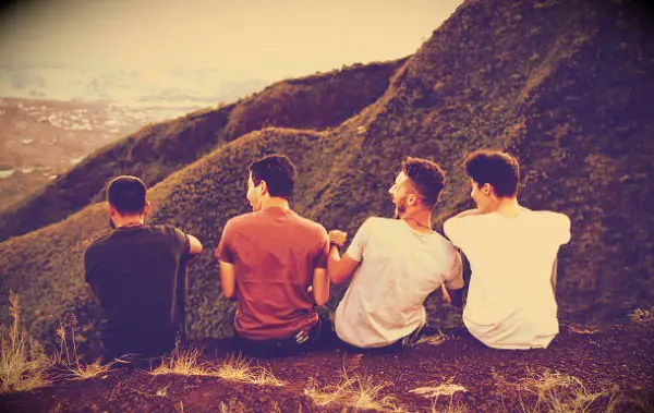 Friends watching a mountain view and having fun.