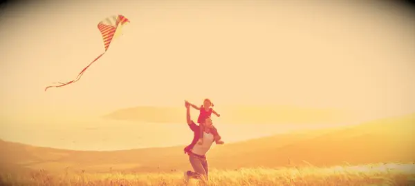 Father and daughter with a kite.