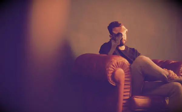 Feeling Lost Quotes to Help You Find Your Way in Life - man sitting on a couch