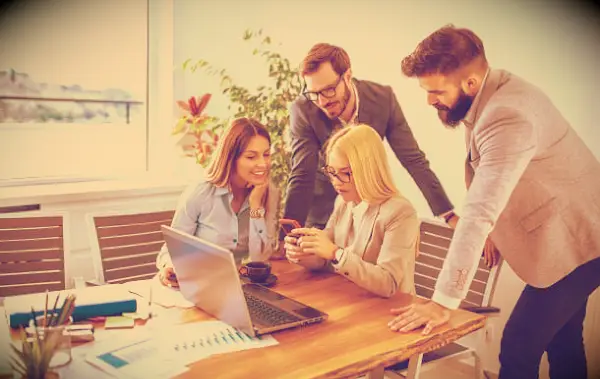 Co-workers looking at a woman