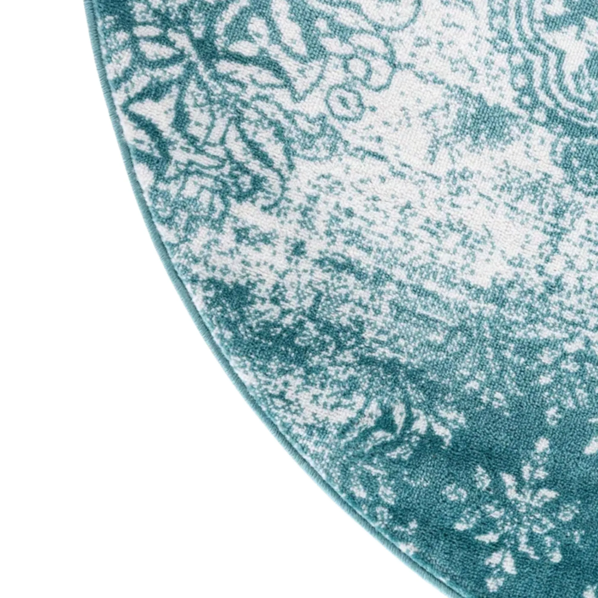 Blågrønt og hvitt sirkulært teppe' loading='lazy' title=