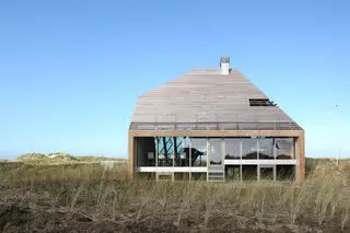 Haus auf einer Sanddüne